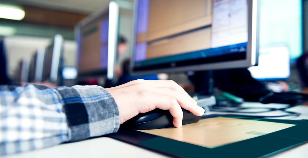 A professional working on a computer