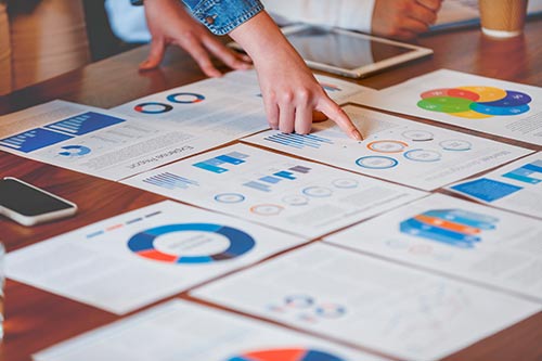 charts and graphs laid out on a table