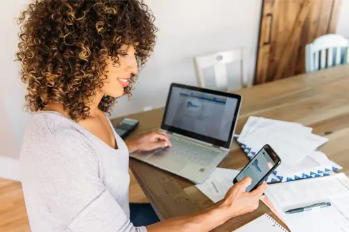 a person looking finances on a phone