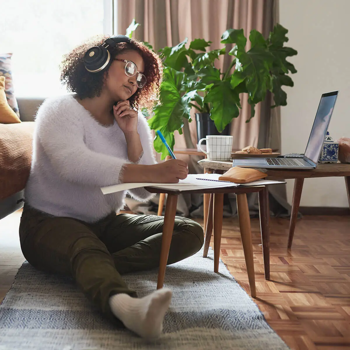 lady sitting by a coffee table